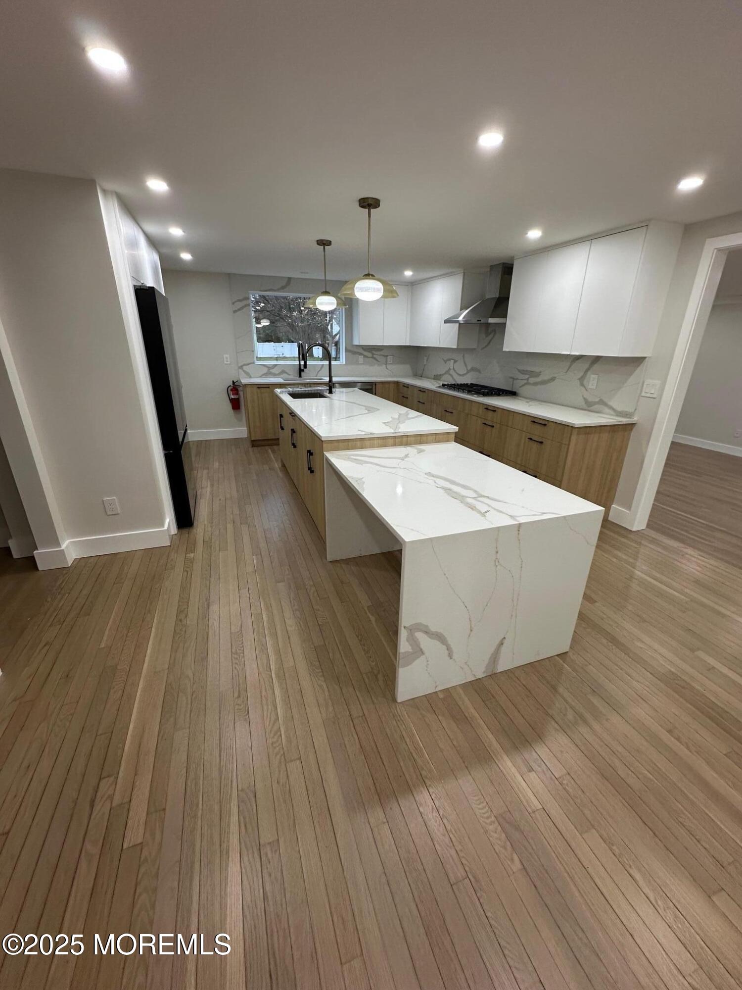 469 Wall Street Eatontown, NJ 07724 - Photo 5 of 17 a large room with wooden floor