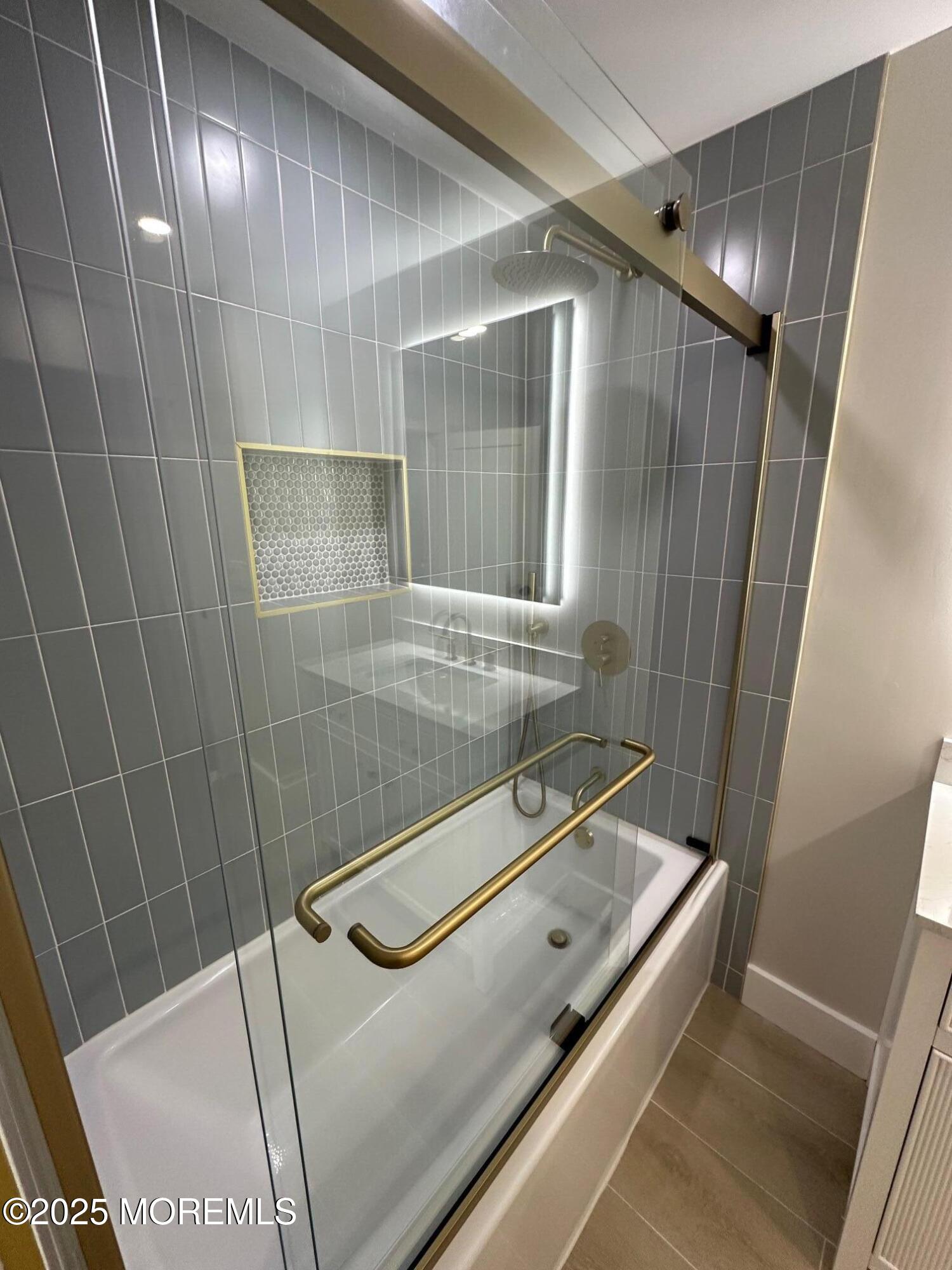 469 Wall Street Eatontown, NJ 07724 - Photo 8 of 17 a bathroom with a tub and a shower