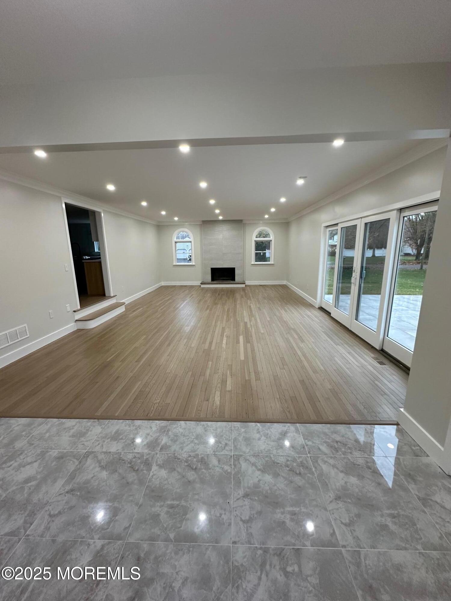 469 Wall Street Eatontown, NJ 07724 - Photo 8 of 17 a view of an empty room with wooden floor