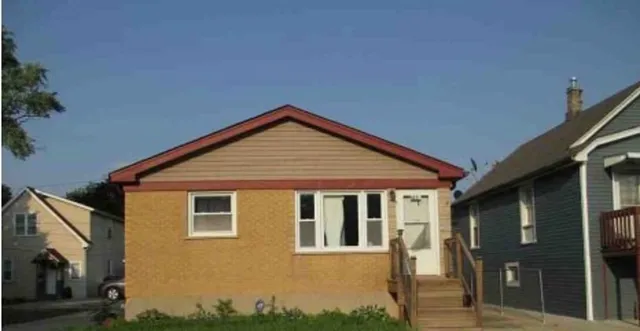 a front view of a house with yard