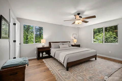 a bedroom with a large bed and a window