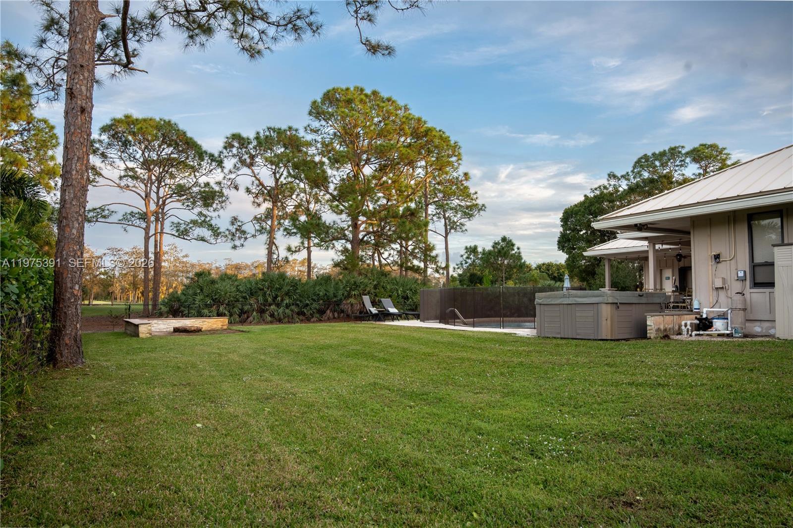 1872 Southeast Colony Way Jupiter, FL 33478 - Photo 8 of 26 a view of a house with a big yard and potted plants