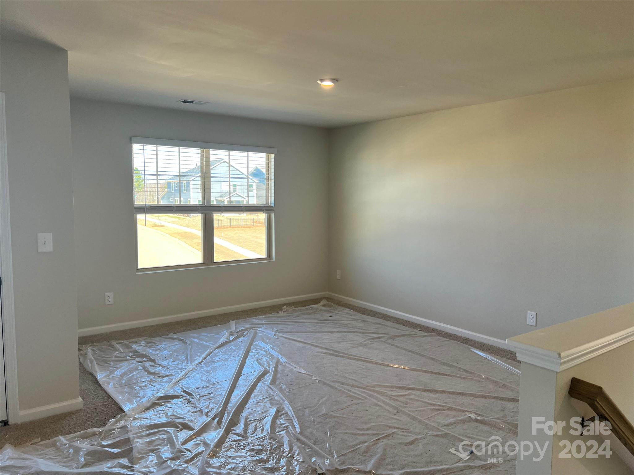 2541 Crimson Way Monroe, NC 28112 - Photo 11 of 22 a view of an empty room and window