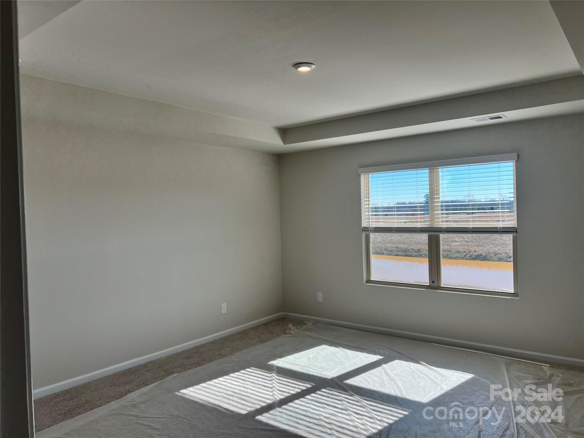 2541 Crimson Way Monroe, NC 28112 - Photo 12 of 22 an empty room with windows