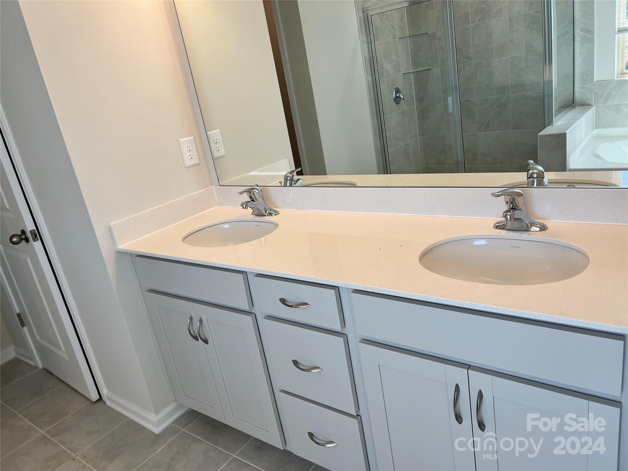 2541 Crimson Way Monroe, NC 28112 - Photo 15 of 22 a bathroom with a sink and a mirror
