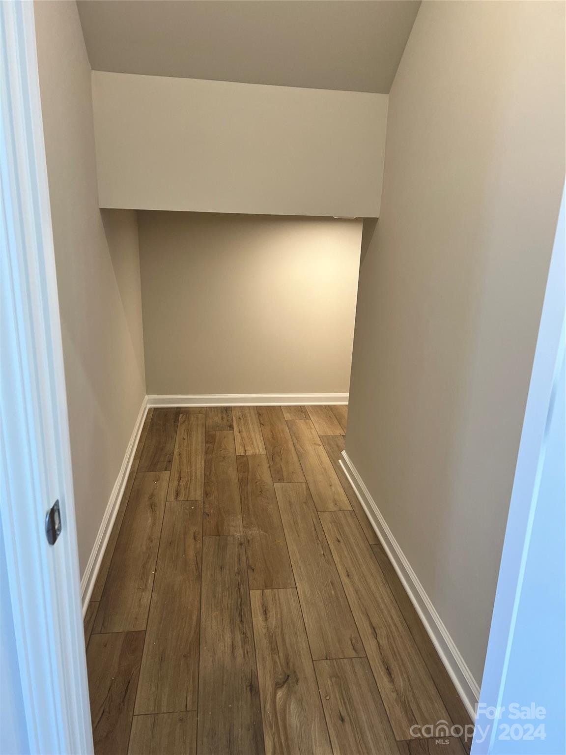 2541 Crimson Way Monroe, NC 28112 - Photo 9 of 22 a view of empty room with wooden floor