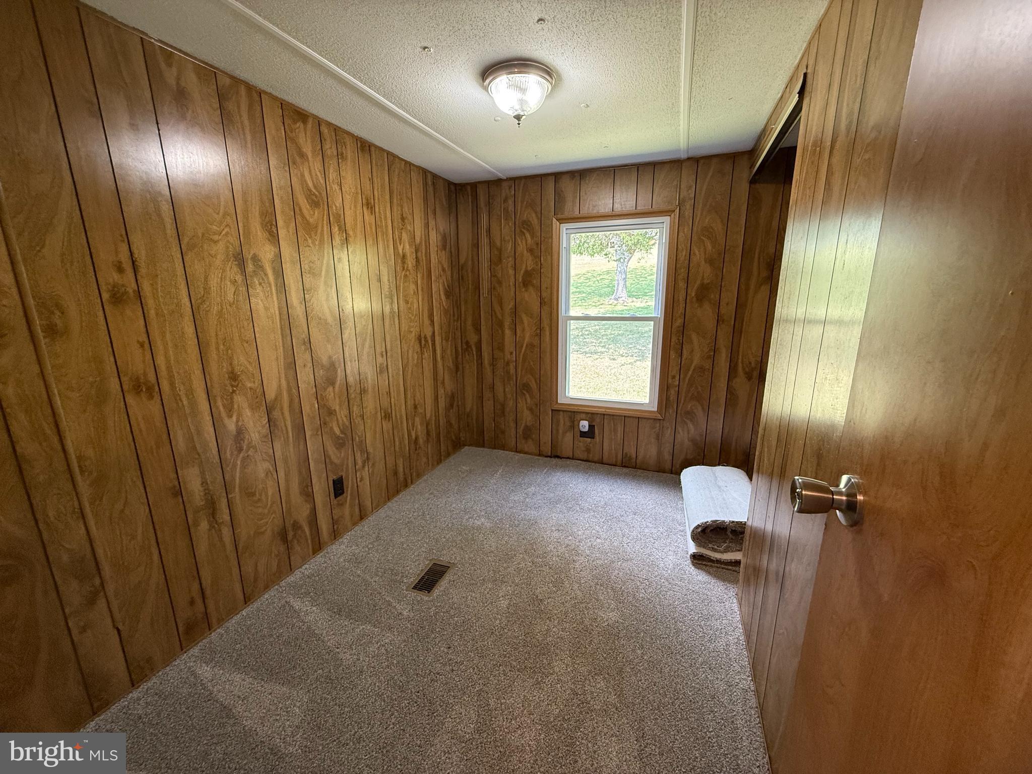 192 AA Rogers Road Augusta, WV 26704 - Photo 23 of 34 a view of an empty room with a window