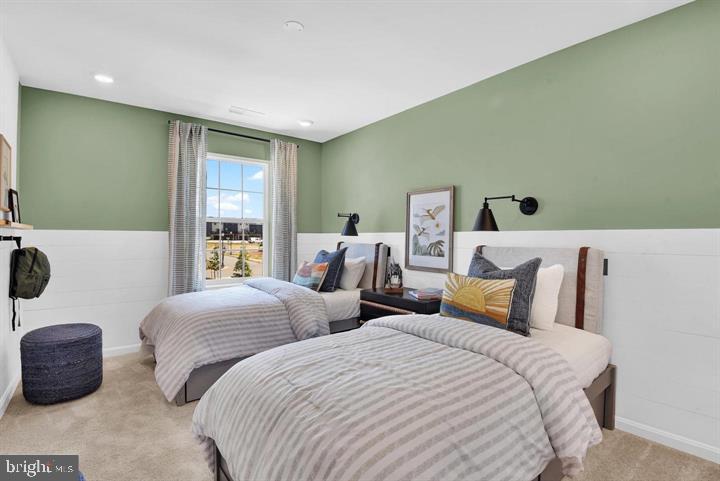 491 Hanson Street Frederick, MD 21701 - Photo 20 of 24 Serene twin bedroom with fresh green accents.