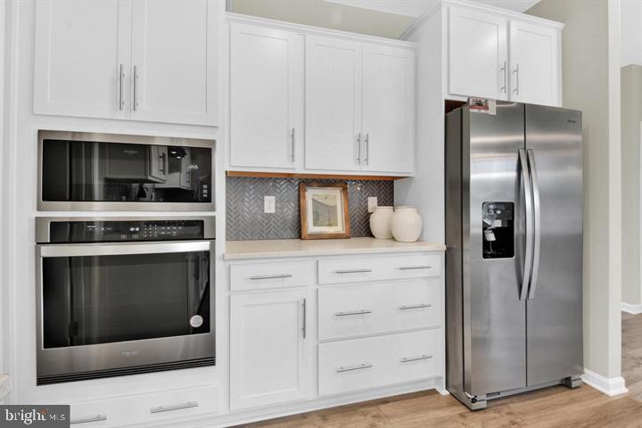491 Hanson Street Frederick, MD 21701 - Photo 5 of 24 Sleek modern kitchen with stylish appliances.
