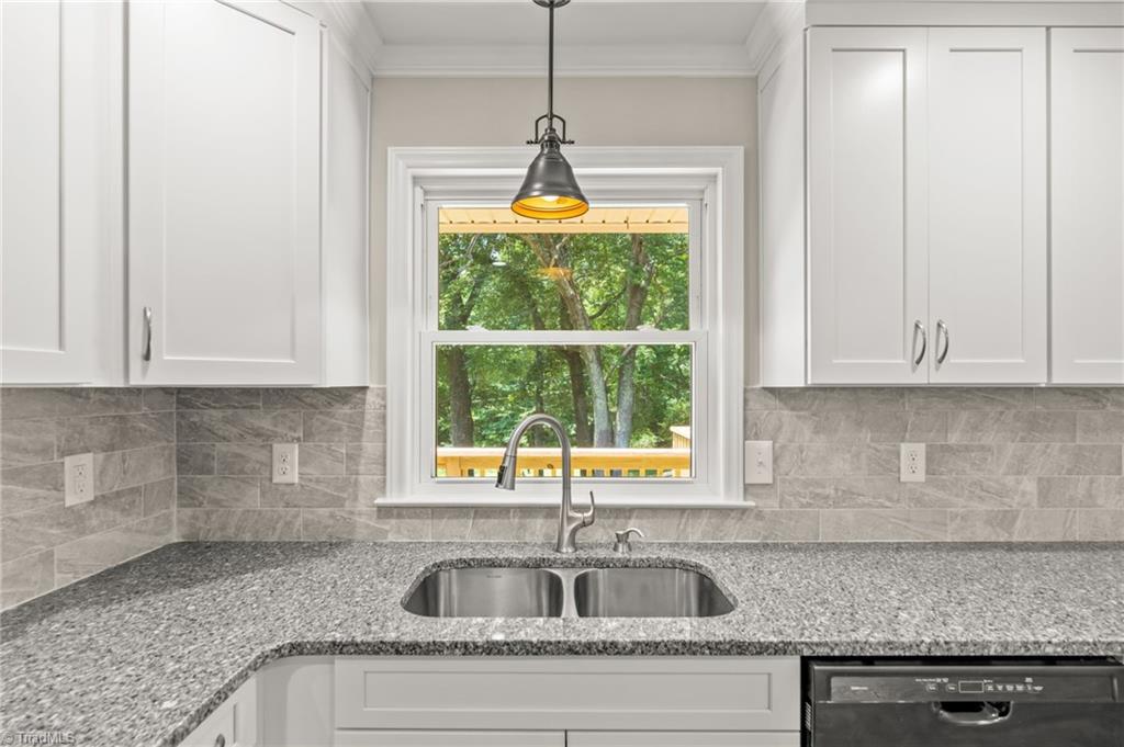 5902 Siler Road Greensboro, NC 27406 - Photo 11 of 49 Kitchen sink with view to the backyard.