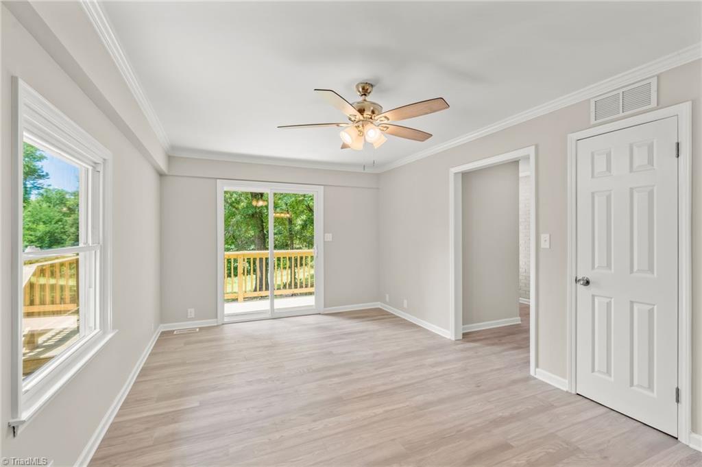 5902 Siler Road Greensboro, NC 27406 - Photo 16 of 49 Primary suite has a sliding glass door leading to the deck.