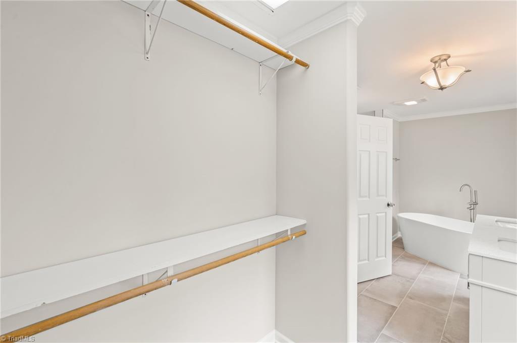 5902 Siler Road Greensboro, NC 27406 - Photo 19 of 49 Lots of closet space is found in primary bathroom.