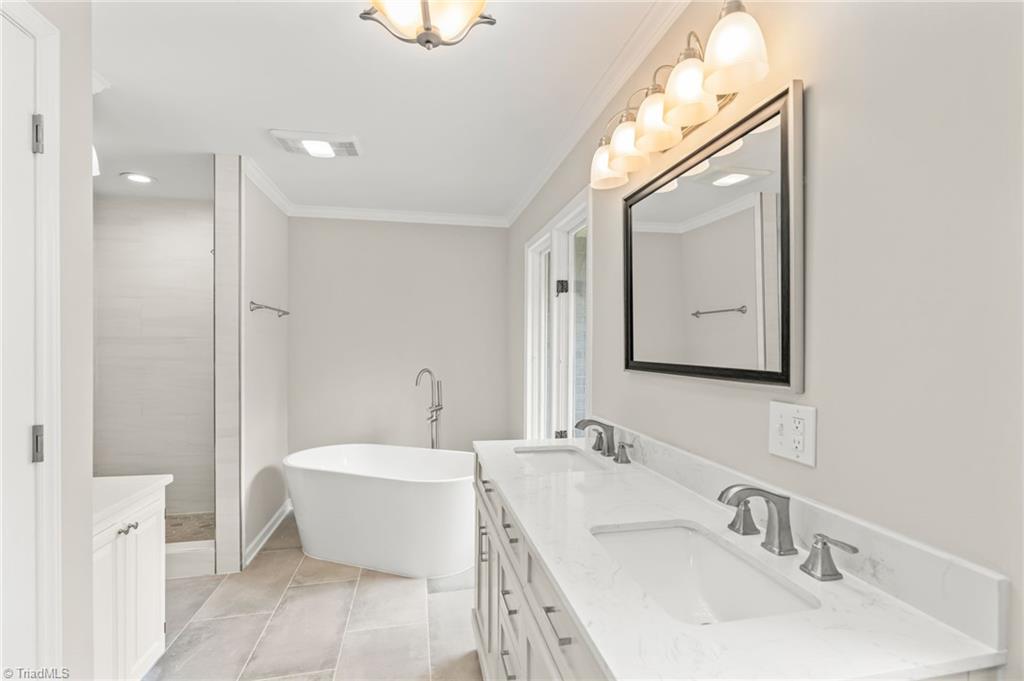 5902 Siler Road Greensboro, NC 27406 - Photo 20 of 49 Sleek-looking bathtub and walk-in shower! Beautiful!