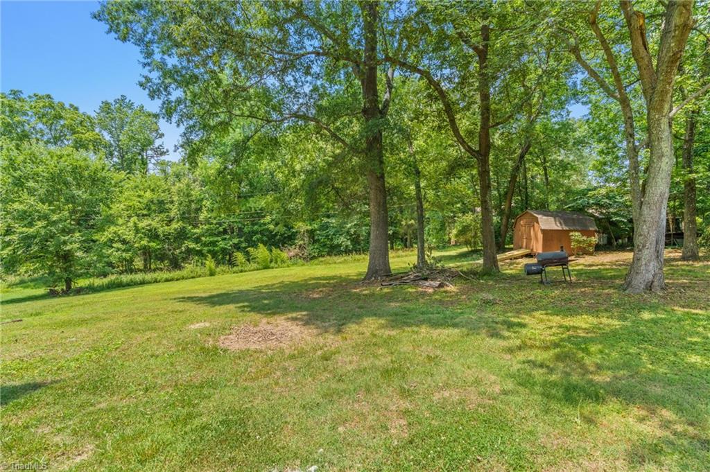 5902 Siler Road Greensboro, NC 27406 - Photo 38 of 49 Beautiful backyard with a large outdoor shed.