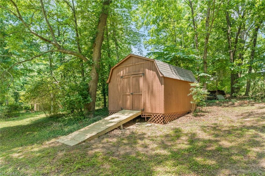 5902 Siler Road Greensboro, NC 27406 - Photo 39 of 49 Shed has been repaired, pressure washed, and repainted. New ramp.