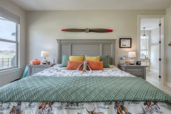 a bedroom with a bed and a dresser