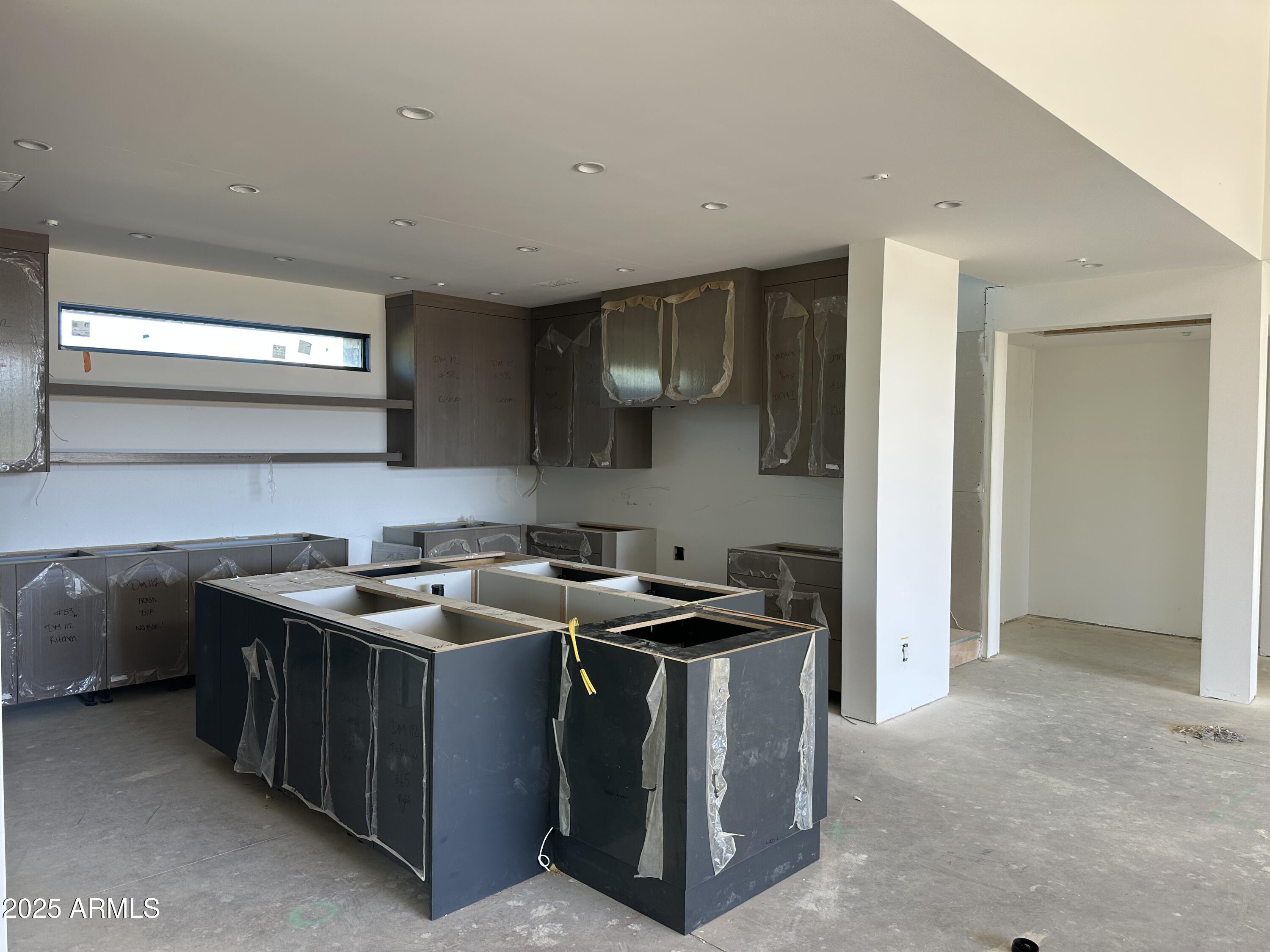 10023 East Filaree Lane Scottsdale, AZ 85262 - Photo 11 of 41 a utility room with stainless steel appliances granite countertop a stove a sink and a refrigerator