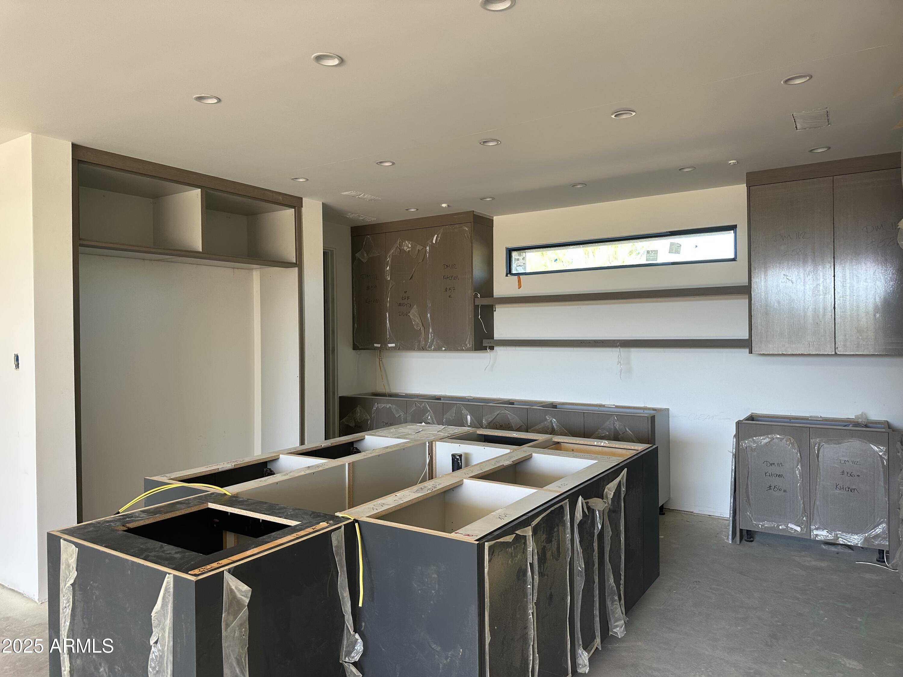 10023 East Filaree Lane Scottsdale, AZ 85262 - Photo 12 of 41 a kitchen that has a sink and a stove