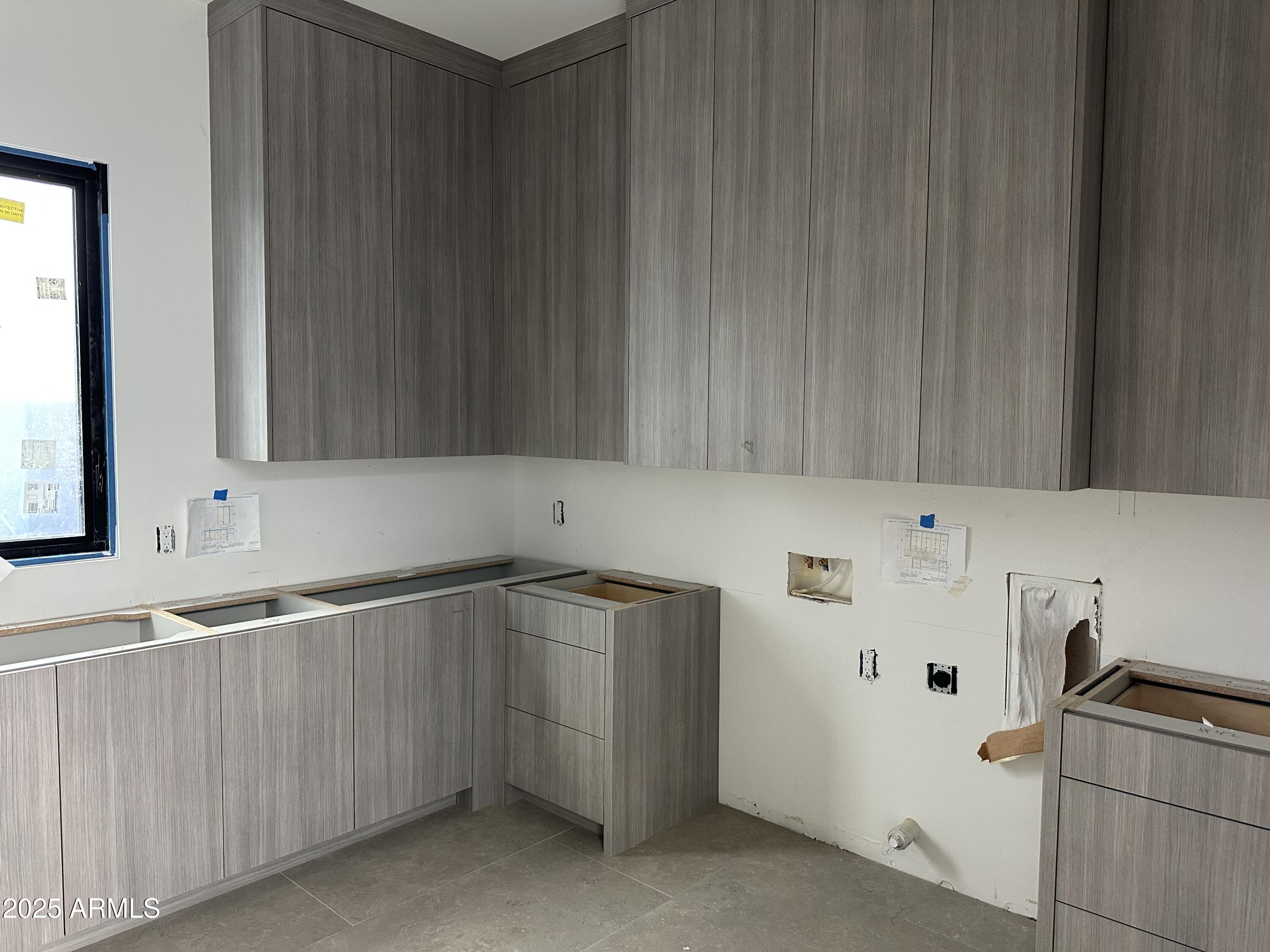 10023 East Filaree Lane Scottsdale, AZ 85262 - Photo 19 of 41 a utility room with cabinets