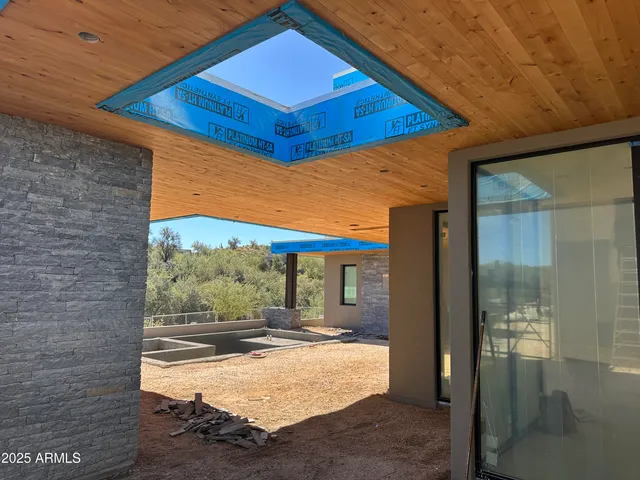 a view of a hall with wooden door