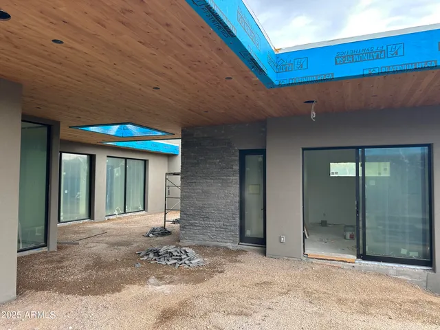 a view of a balcony with chair and table
