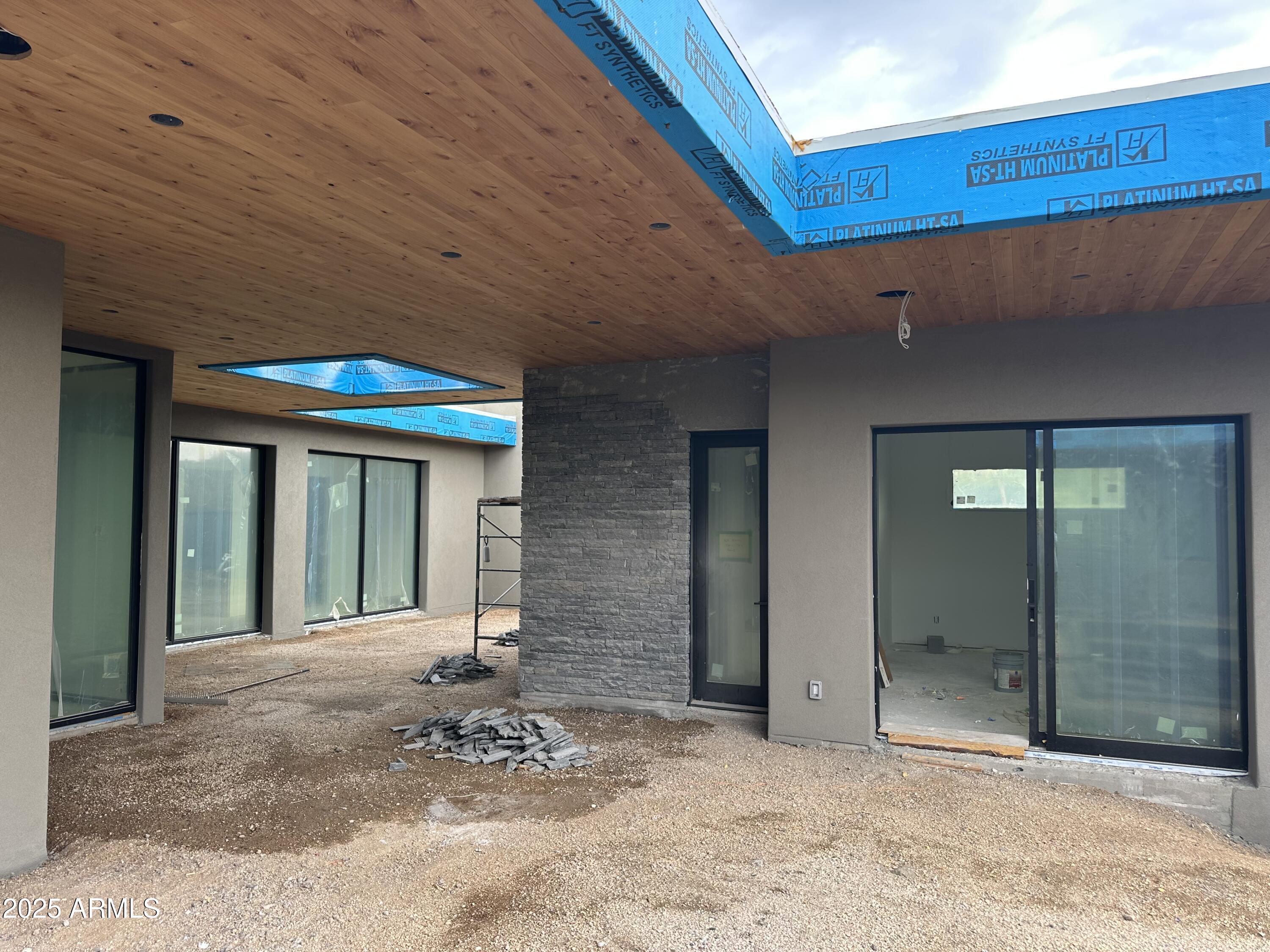 10023 East Filaree Lane Scottsdale, AZ 85262 - Photo 22 of 41 a view of a hall with wooden door