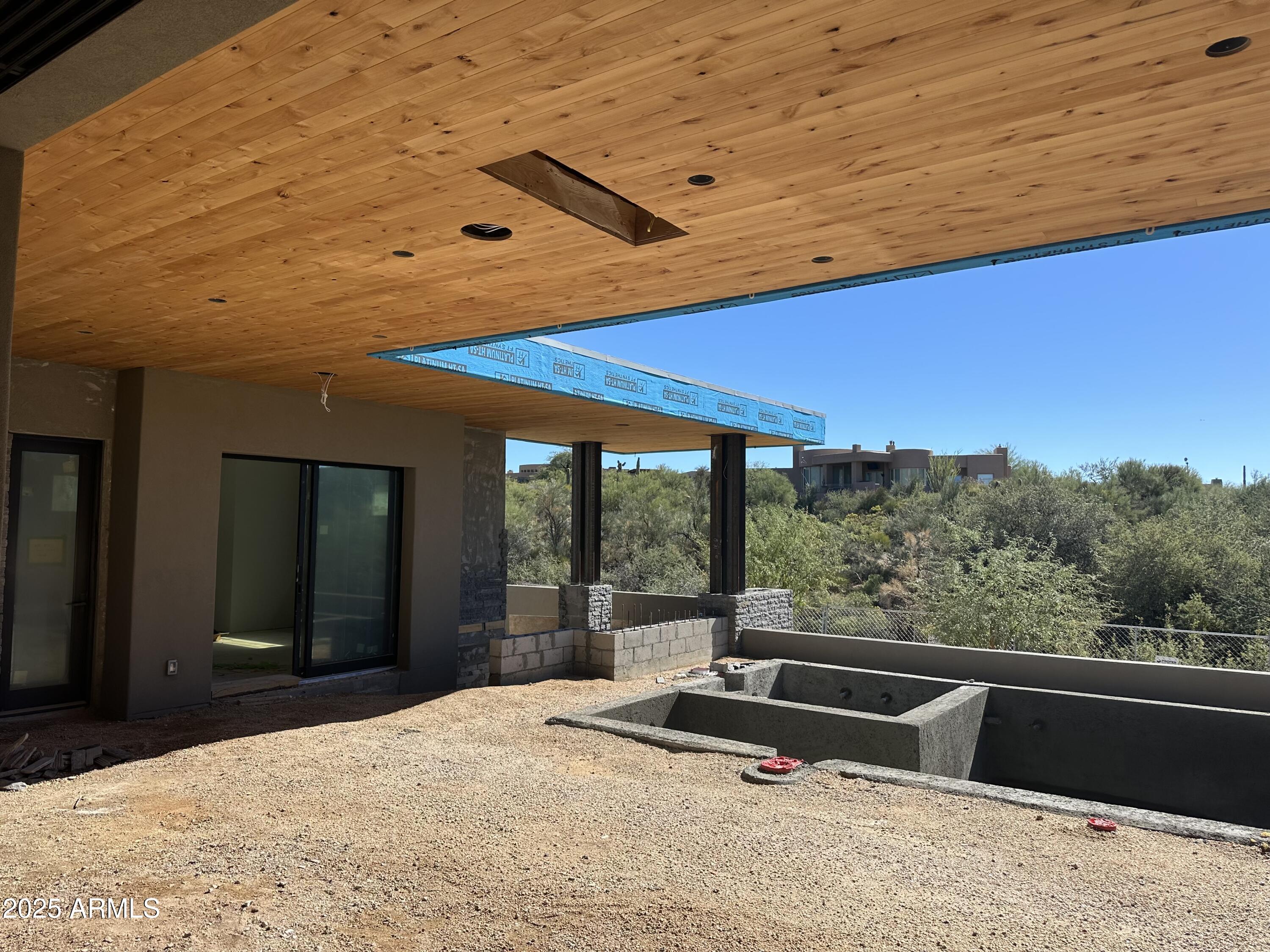 10023 East Filaree Lane Scottsdale, AZ 85262 - Photo 23 of 41 a view of a balcony with chair and table