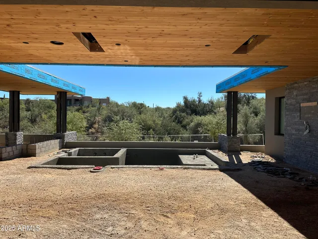 a view of a two chairs in the patio