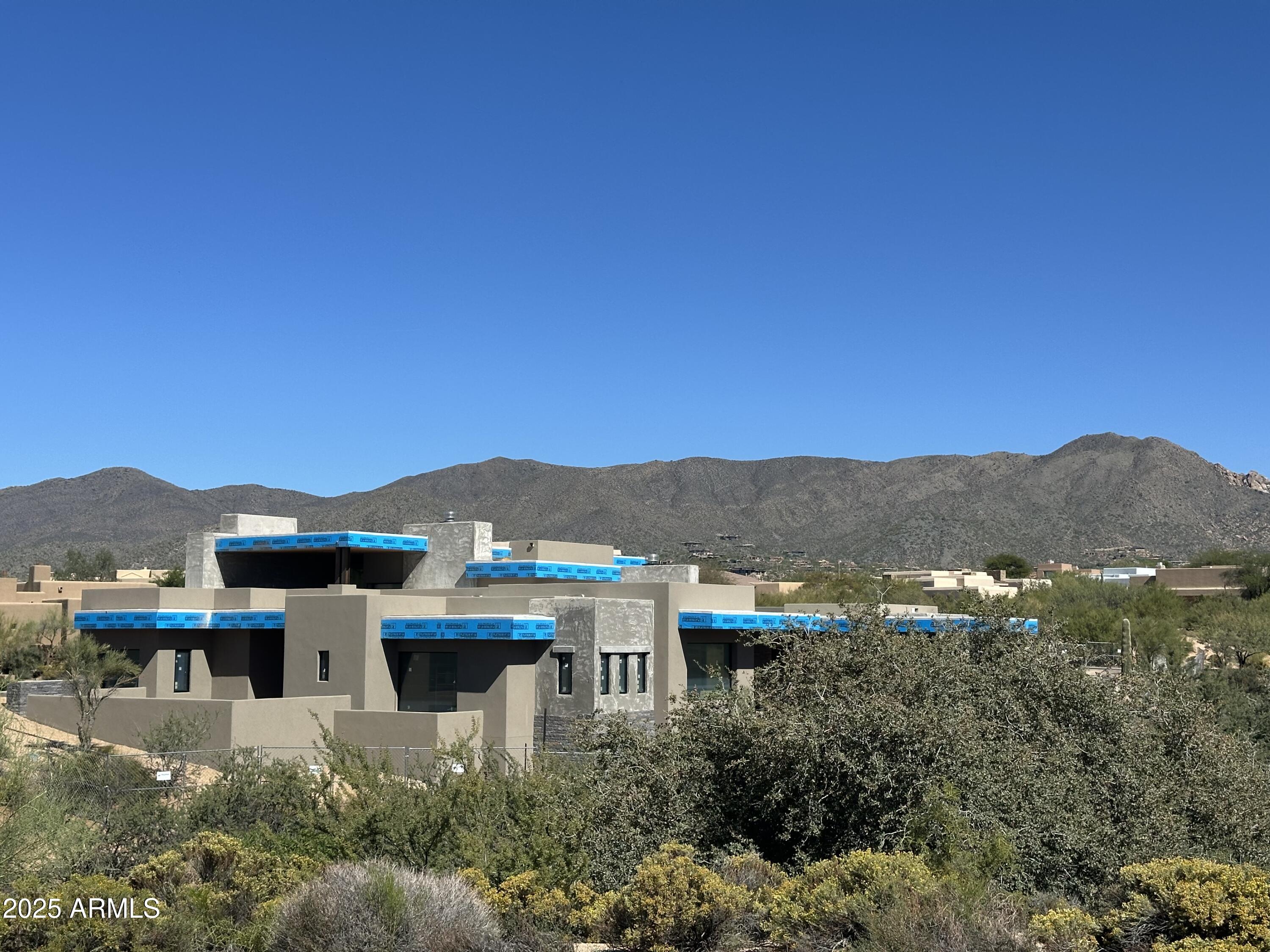 10023 East Filaree Lane Scottsdale, AZ 85262 - Photo 29 of 41 a view of a town with mountains in the background