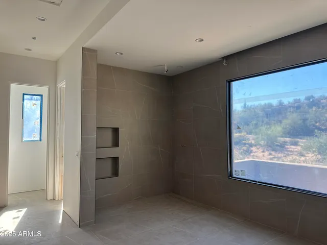 a bathroom with a shower and a sink