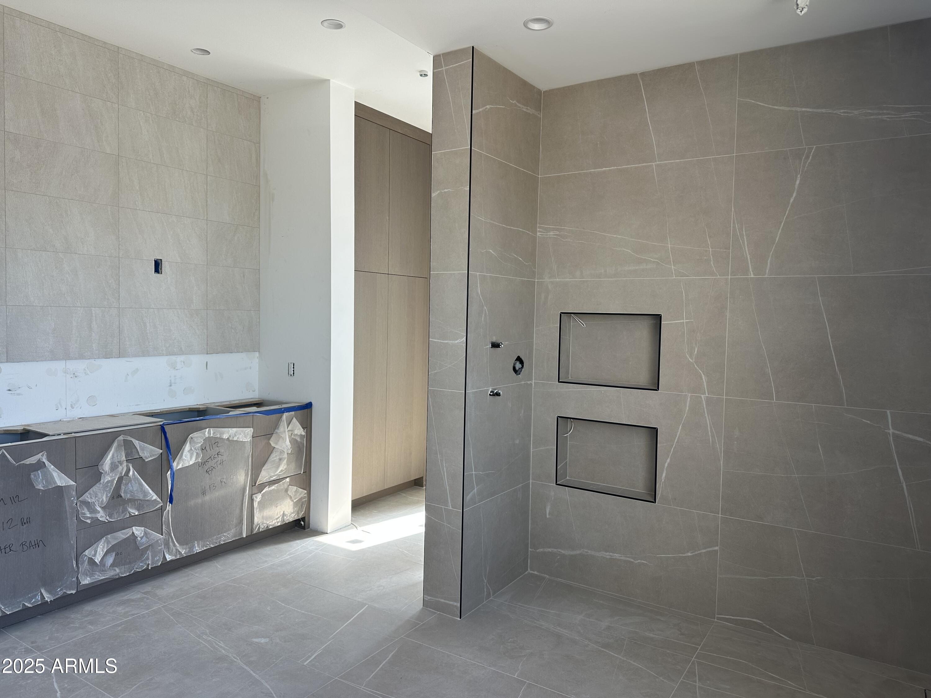 10023 East Filaree Lane Scottsdale, AZ 85262 - Photo 7 of 41 a bathroom with a shower and a sink