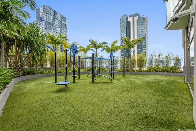 a view of a park with swings and slides