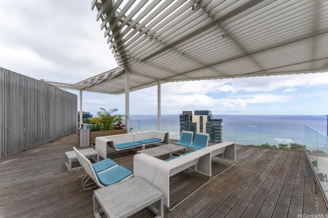 a view of living room with patio furniture and wooden floor