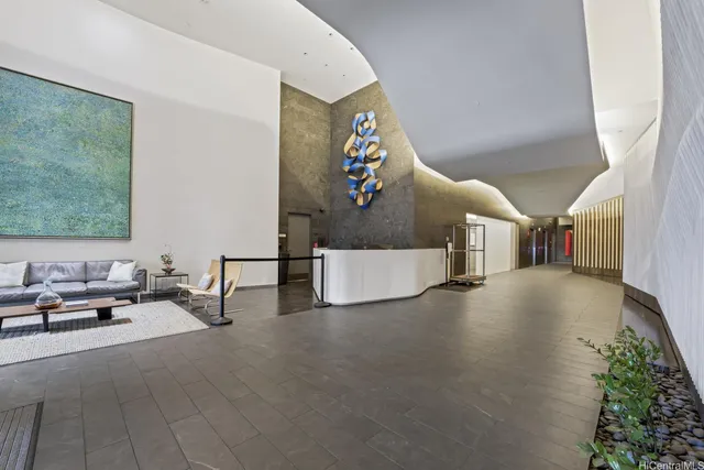 a living room with furniture and a potted plant