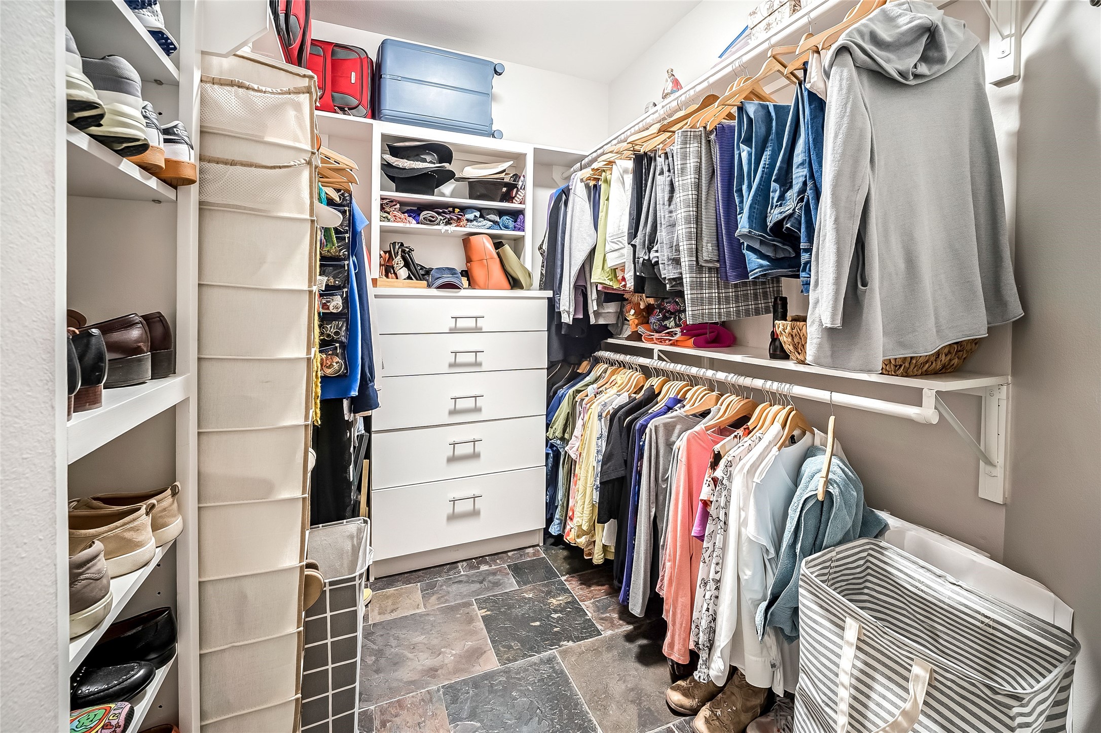 2111 Welch Street, Unit A113 Houston, TX 77019 - Photo 15 of 30 Primary Walk-In Closet w/ Chest of Drawers