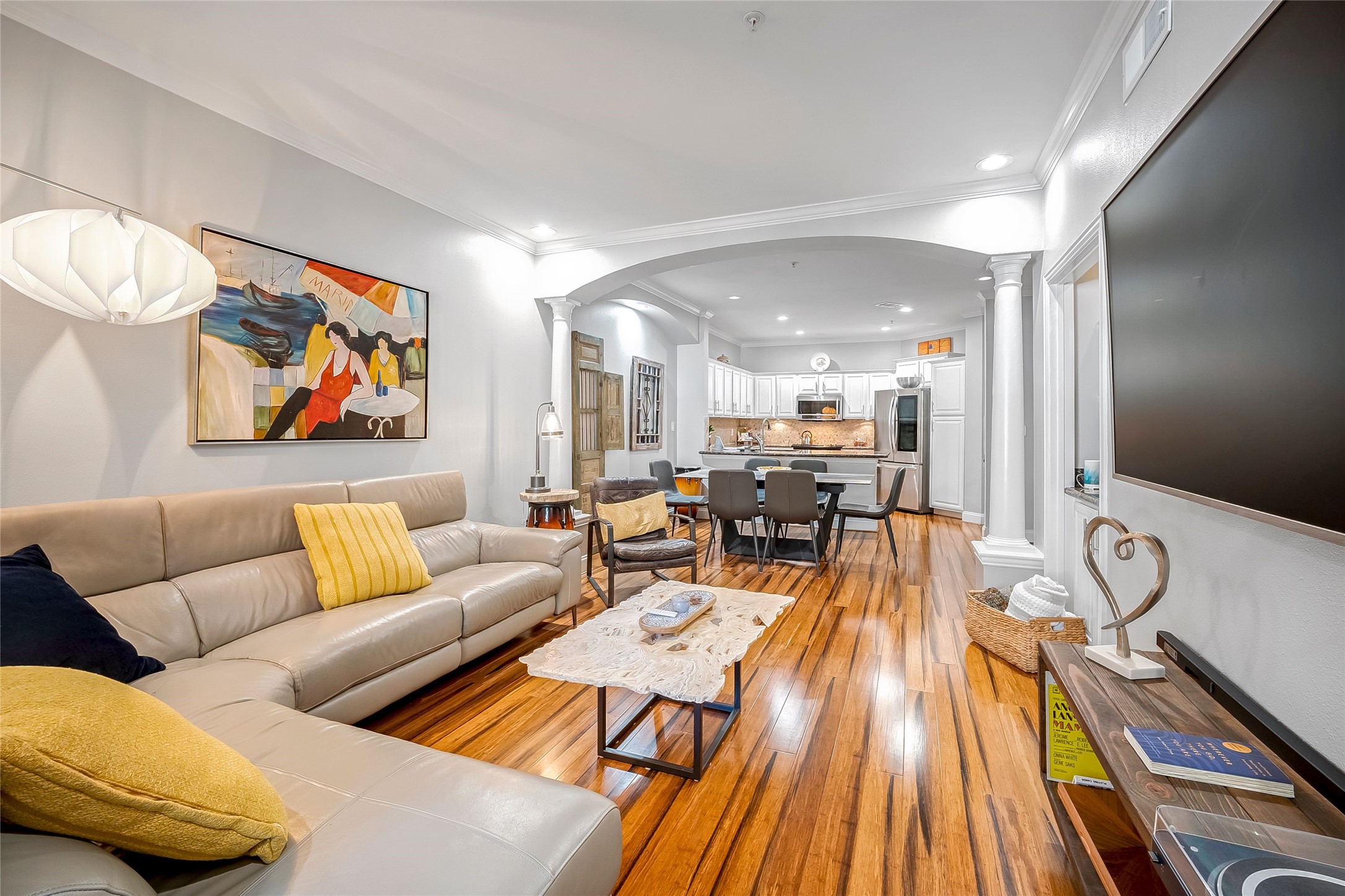 2111 Welch Street, Unit A113 Houston, TX 77019 - Photo 4 of 30 Patio opens to light-filled living and dining-perfect for easy entertaining. Easy to see the open layout from this perspective