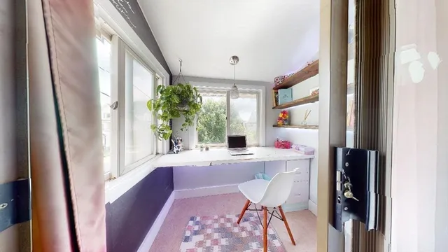 a workspace with furniture and a window