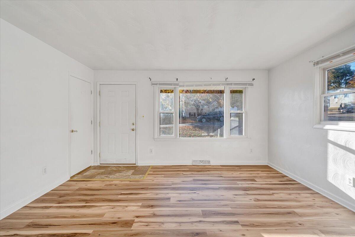 725 Ramada Road Vinton, VA 24179 - Photo 11 of 38 a view of empty room with wooden floor and fan