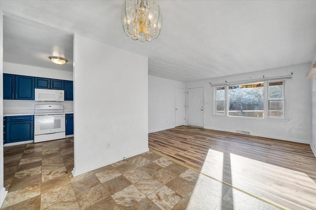 725 Ramada Road Vinton, VA 24179 - Photo 13 of 38 a view of empty room with wooden floor and window