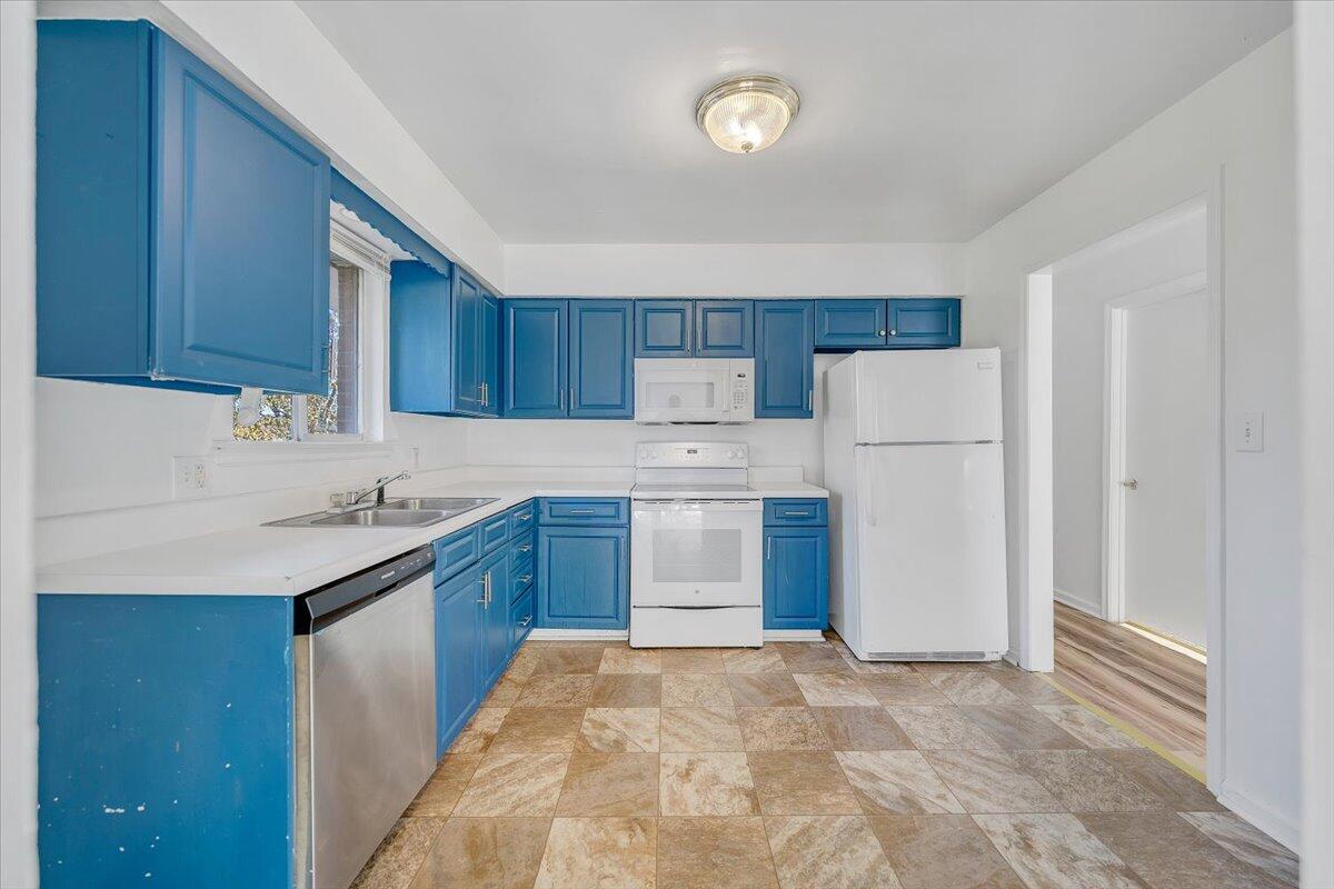 725 Ramada Road Vinton, VA 24179 - Photo 15 of 38 a kitchen with a refrigerator sink and cabinets