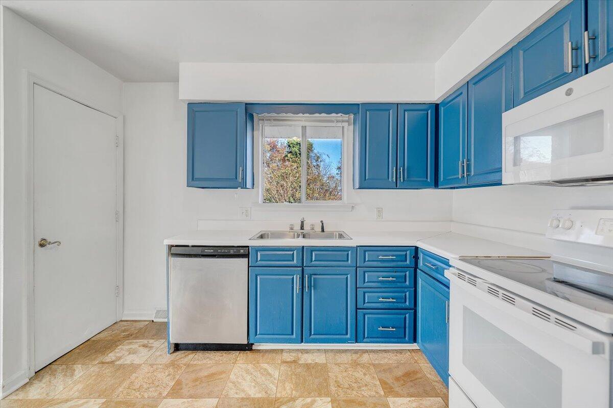 725 Ramada Road Vinton, VA 24179 - Photo 17 of 38 a kitchen with stainless steel appliances granite countertop a sink dishwasher stove and cabinets