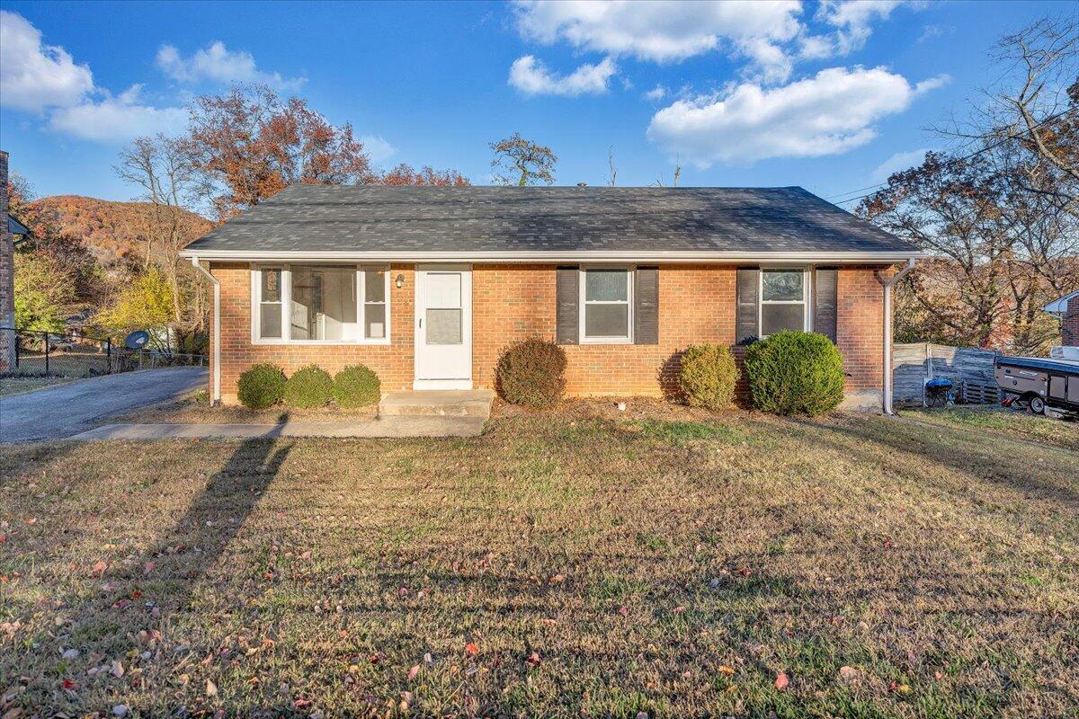 725 Ramada Road Vinton, VA 24179 - Photo 2 of 38 a front view of a house with a yard and potted plants