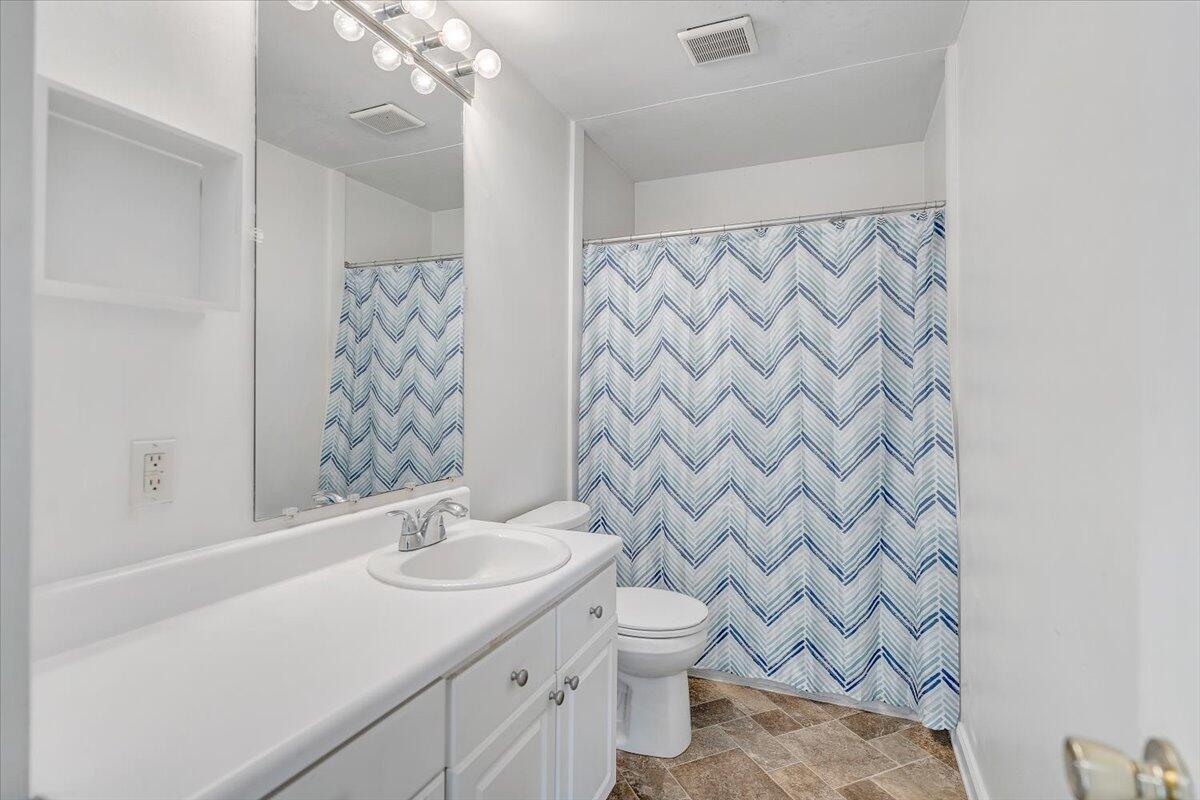 725 Ramada Road Vinton, VA 24179 - Photo 25 of 38 a bathroom with a granite countertop sink and a toilet