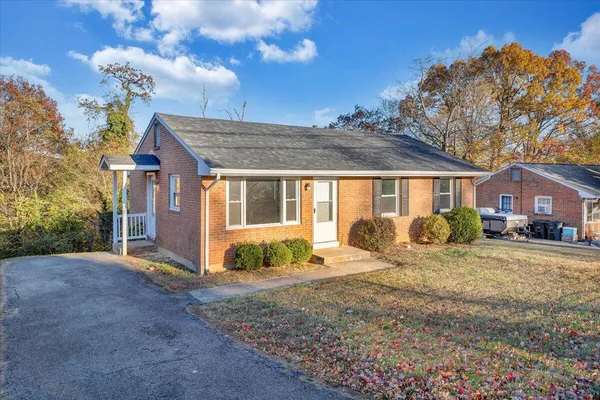 a big room with wooden floor and windows