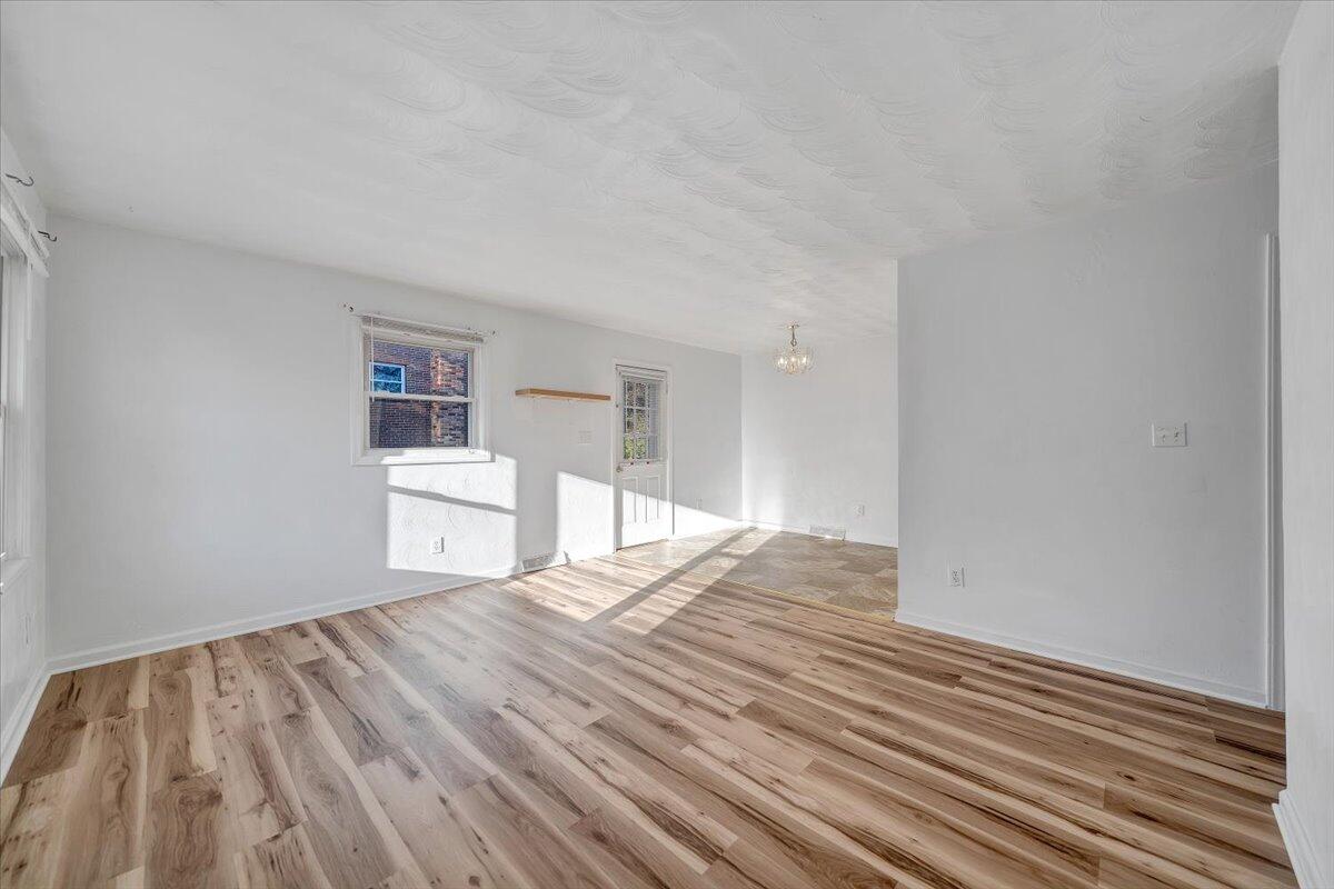 725 Ramada Road Vinton, VA 24179 - Photo 7 of 38 a view of wooden floor and windows in a room
