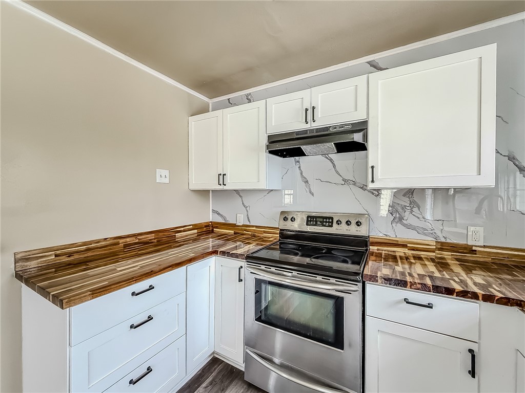 3437 Austin Street Corpus Christi, TX 78411 - Photo 15 of 35 a kitchen with white cabinets stainless steel appliances and sink