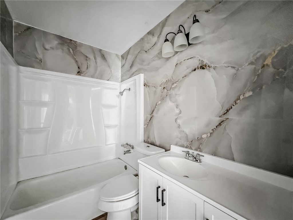 3437 Austin Street Corpus Christi, TX 78411 - Photo 20 of 35 a bathroom with a sink toilet and shower