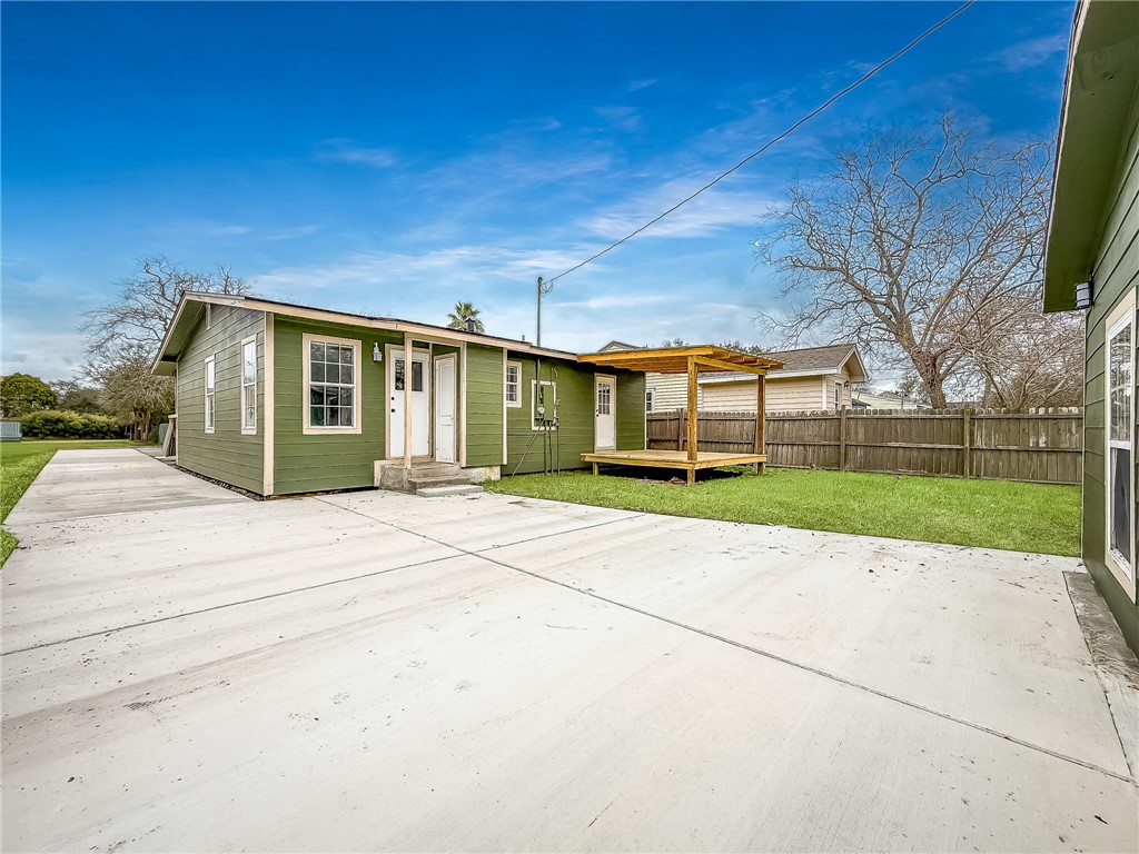 3437 Austin Street Corpus Christi, TX 78411 - Photo 24 of 35 front view of a house with a garden