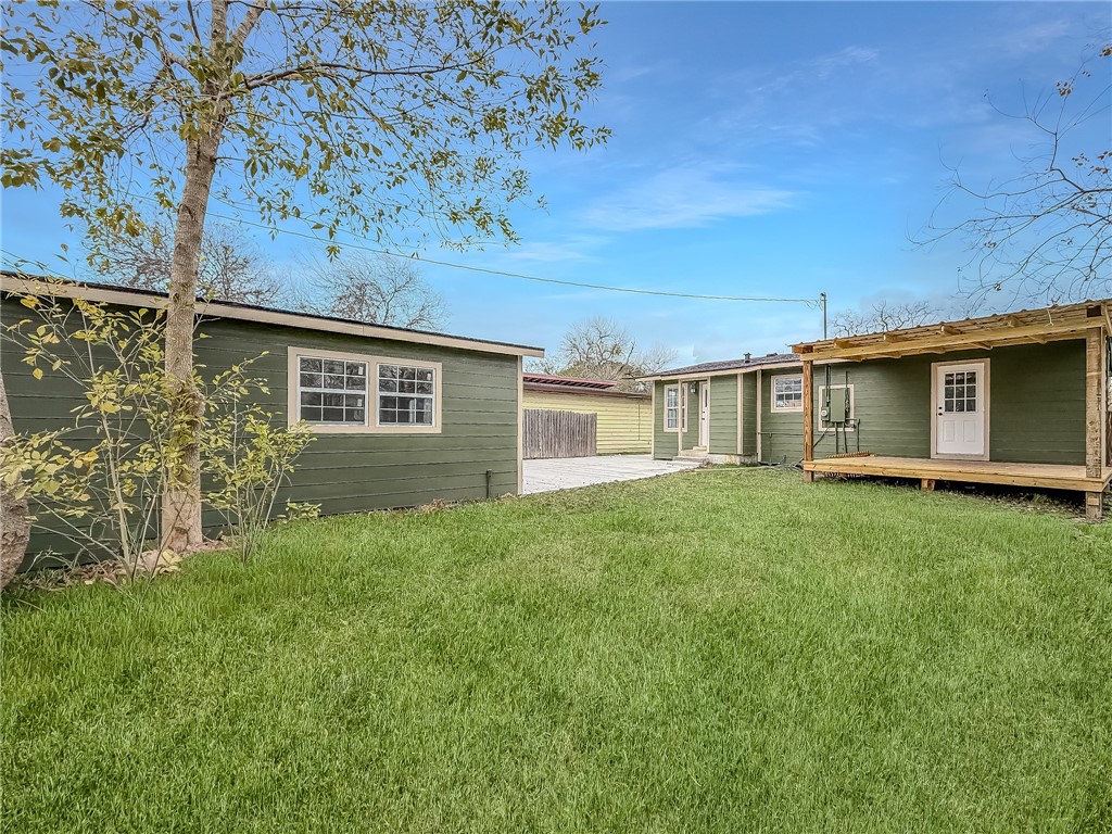 3437 Austin Street Corpus Christi, TX 78411 - Photo 25 of 35 a view of a backyard with plants and large tree