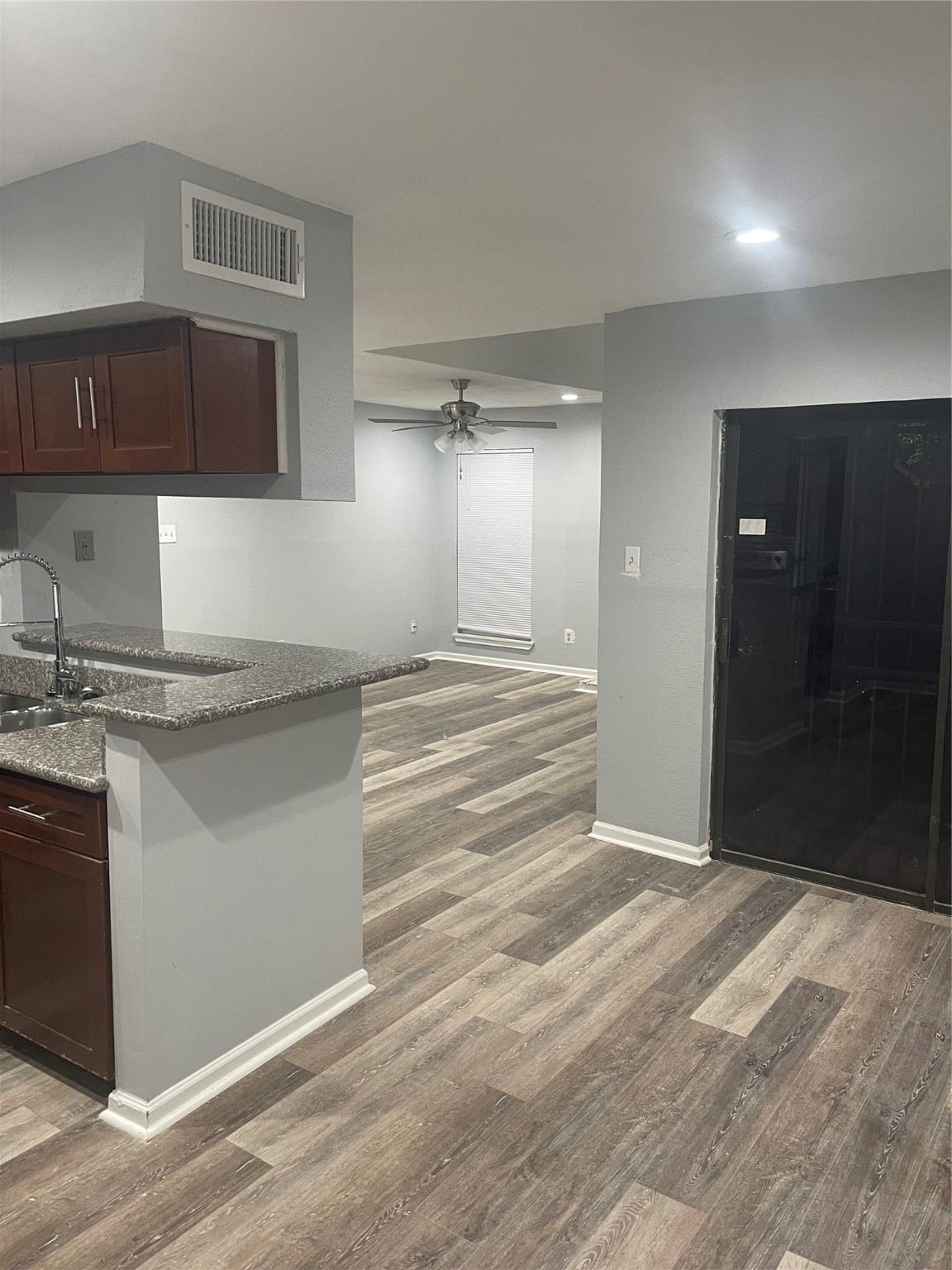 10912 Gulf Freeway, Unit 73 Houston, TX 77075 - Photo 2 of 27 a view of a kitchen cabinets and a wooden floor